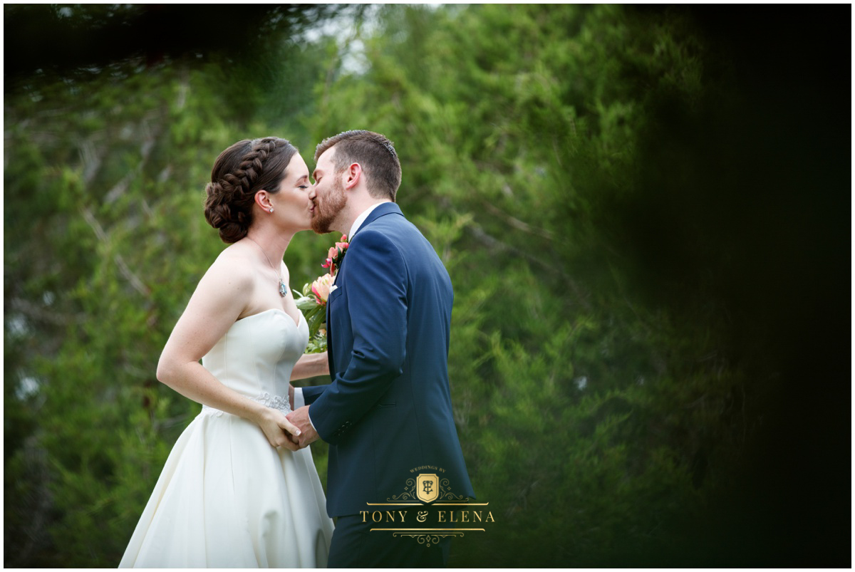 best wedding photographer in austin terrace club bride groom first look intimate kiss