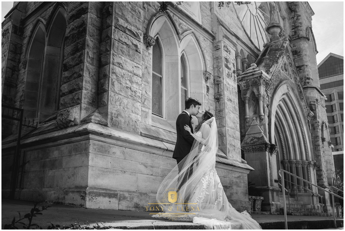 saint mary cathedral austin texas bride groom kiss