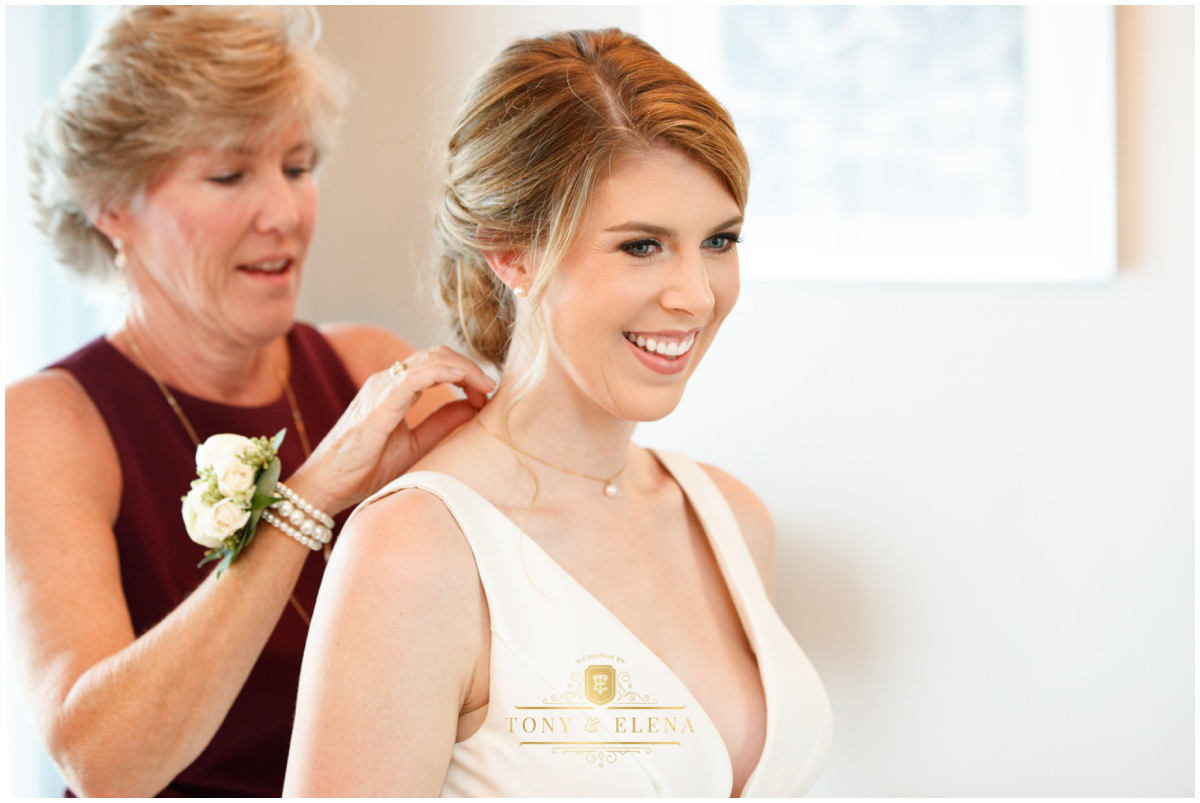 Austin wedding photographer terrace club mom putting on brides necklace