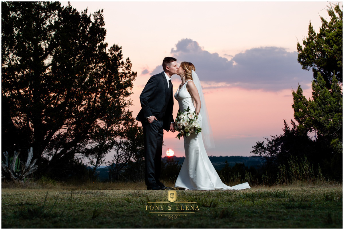 Austin wedding photographer terrace club bride groom kissing sunset