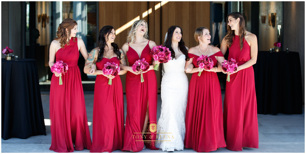 austin wedding photographer bride bridesmaids walking laughin