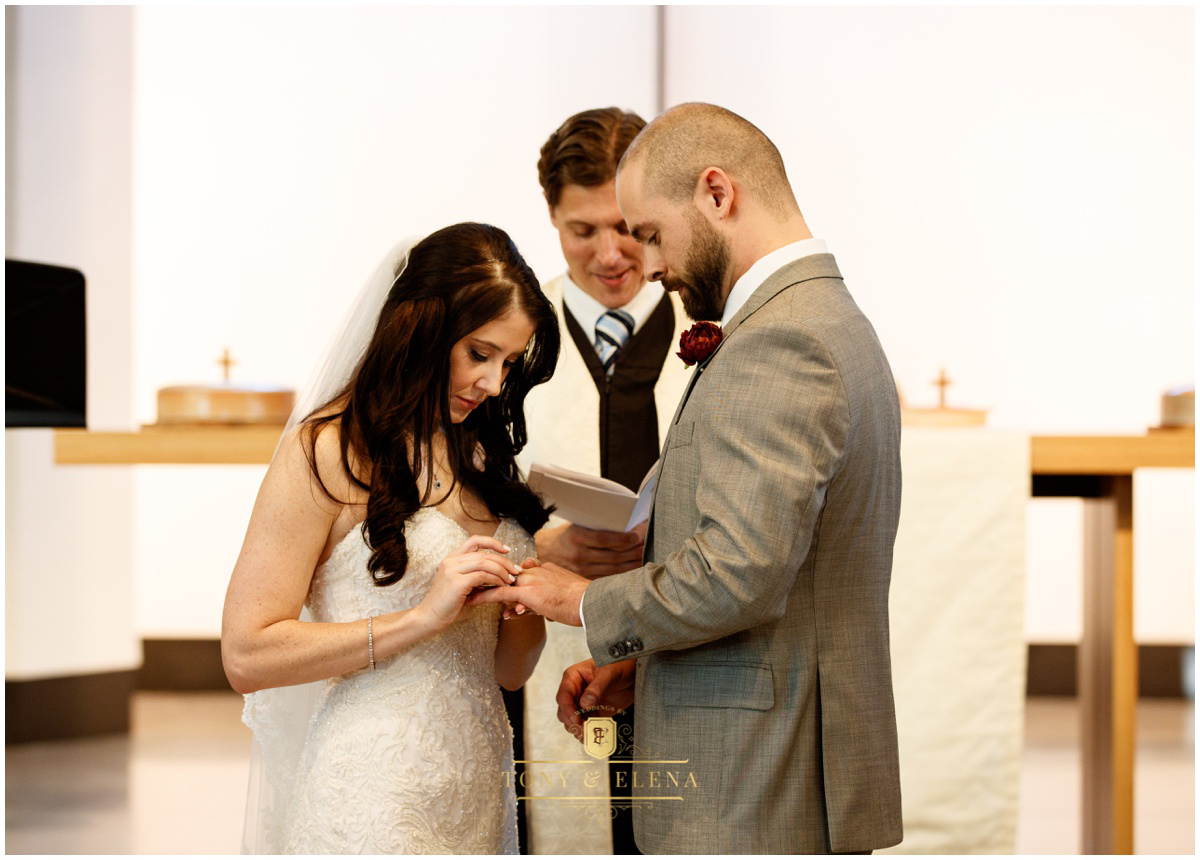 austin wedding photographer bride putting on groom's ring