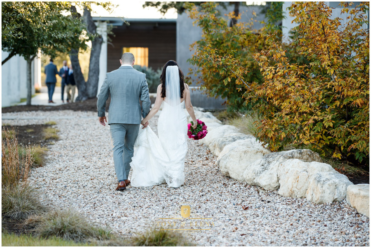 austin wedding photographer bride groom walking away