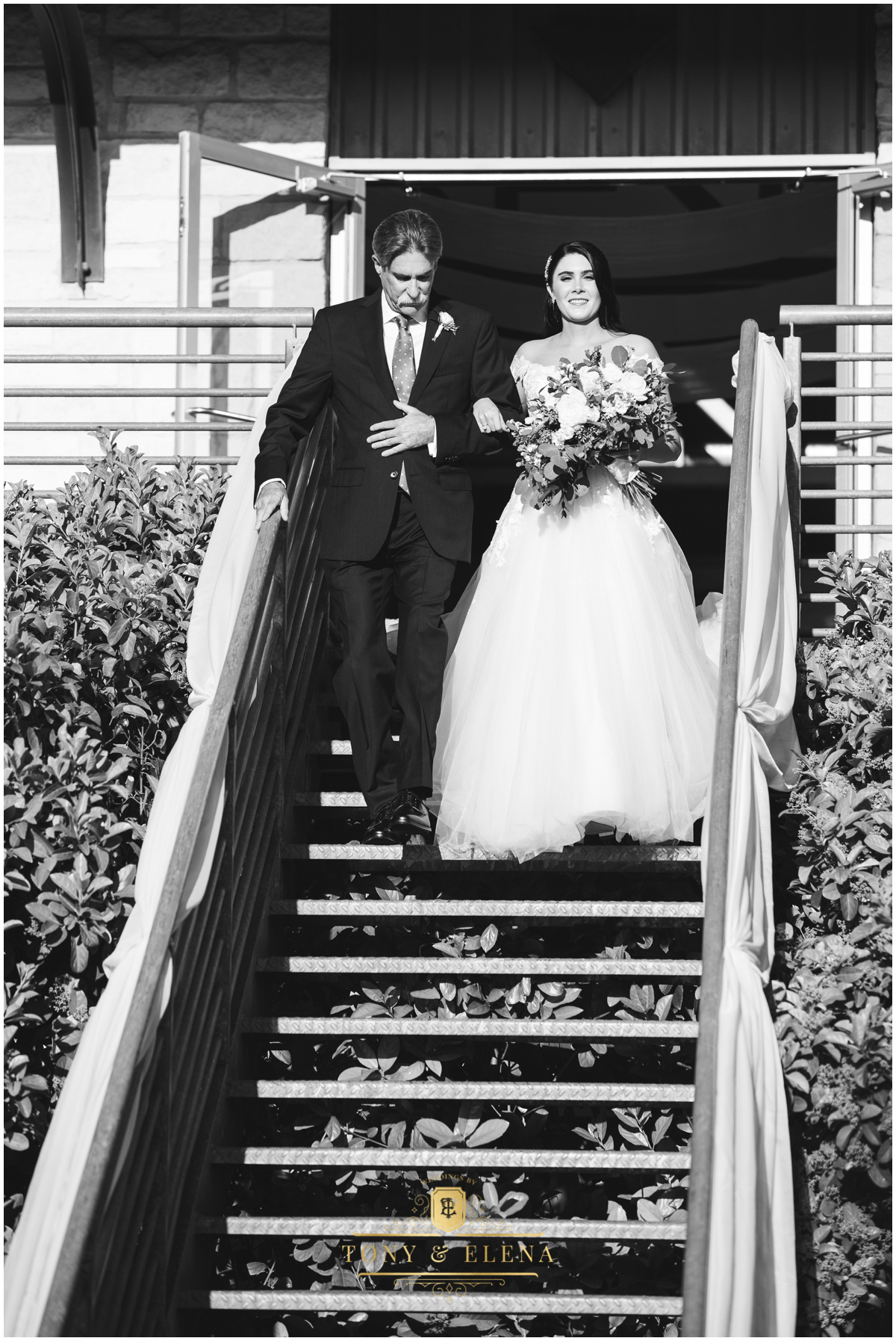 terrace-club-wedding-austin-wedding-photographer-bride-walking-down-stairs